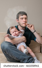 Bad Father Is Smoking Cigarette And Holding Baby.