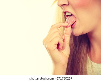 Bad Food Concept. Woman Having Something Disgusting On Tongue Making Disguised Grimace And Gagging.