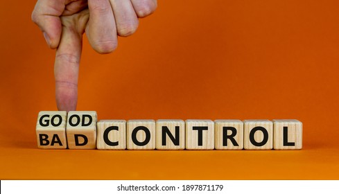 Bad or good control symbol. Businessman turns wooden cubes and changes words 'bad control' to 'good control'. Beautiful orange background. Business and good control concept. Copy space.