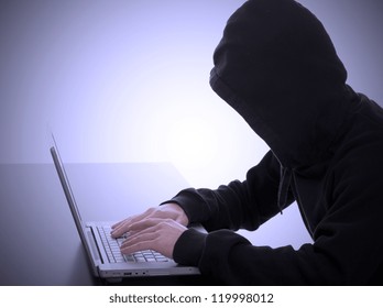 Bad Hacker Working On An Internet Crime