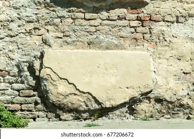 Bad House Foundation With Damaged Bricks Cracked Plaster Wall Texture. 