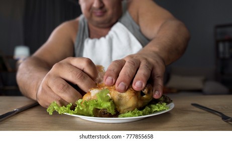 Bad Mannered Man Tearing Greasy Fried Chicken With Fingers, Fatty Food Addiction