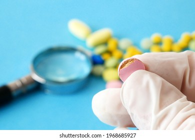 bad medicine takes in hand closeup, expired fake pills concept, closeup
