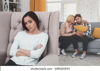 Bad Mood. Cheerless Young Woman Sitting In The Chair While Not Being Happy About Her Relationships