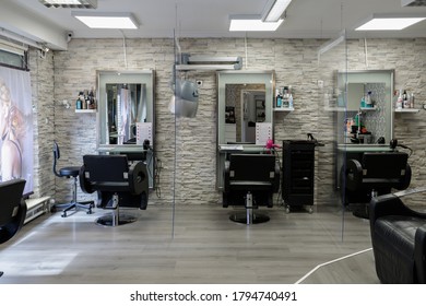 Bad Oeynhausen, Germany,  July 19, 2020:  Interior Of A Hair Salon During The Coronavirus Epidemic. The Separation Plastic Shields Partitions The Seats For The Social Safety Distance