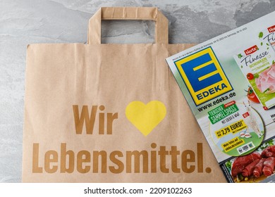 Bad Oeynhausen, Germany - October 02 2022: Edeka Supermarket Brochure And Paper Shopping Bag With Sign 