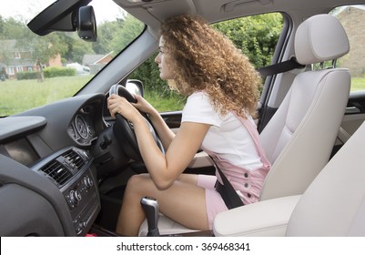 Bad Posture And Bad Driving Position. Female Motorist
