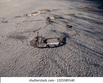 Bad Quality Road With Potholes