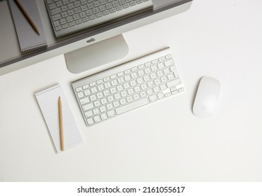 Bad Reichenhall, Bavaria, Germany - 05.27.2022: Apple IMac Computer With Magic Mouse And Wireless Bluetooth Keyboard, Top View.