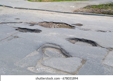 Bad Road. Broken Asphalt
