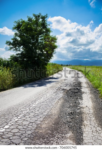 bad road cracked and\
damaged      