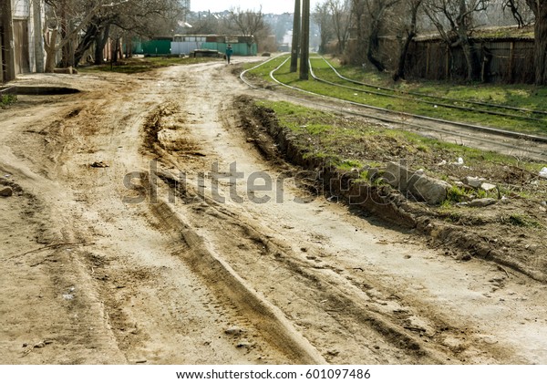 Bad road, damaged by rain and snow, needs repair.\
Broken asphalt coating leads to pothole, dangerous for vehicles and\
pedestrians. Bad emergency road. Dangerous road.  Destruction\
roads, large cracks