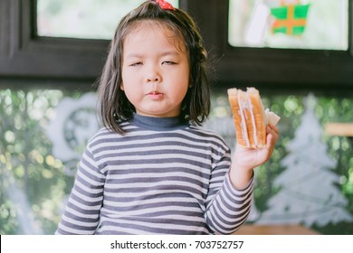 Bad Taste Face Of Sandwich.Little Girl Face Bad Taste In Her Sandwich.