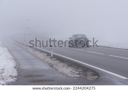 Bad visibility on the road due to heavy fog - dangerous driving conditions