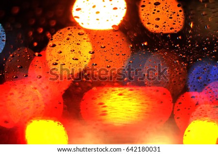 Bad visibility when drunken drive in rainy night, blind vision concept, blurred abstract bokeh from spot of light as background