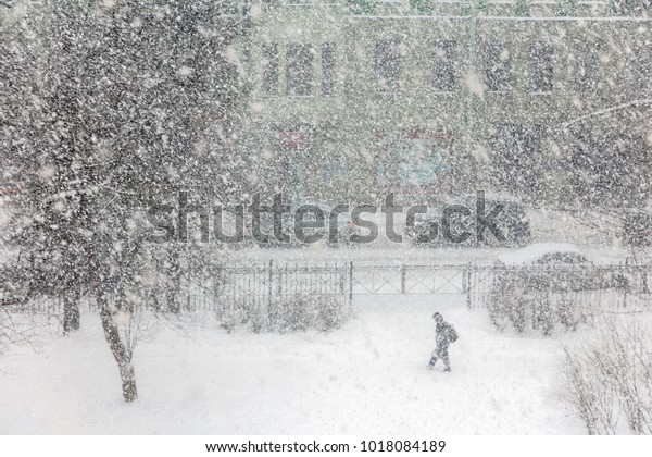 Bad weather in a city in winter: a heavy\
snowfall and blizzard