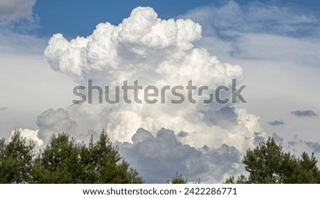  Bad weather with dark clouds. Rain and thunderstorms in the sky. Cumulus and cumulonimbus formation. 