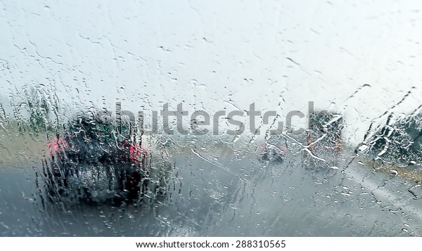 Bad Weather Driving - poor view caused by heavy\
rain and  spray water