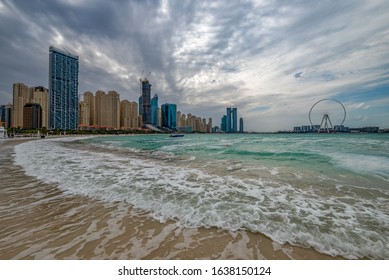 Bad weather in Dubai with rain, strong wind and waves on the beach