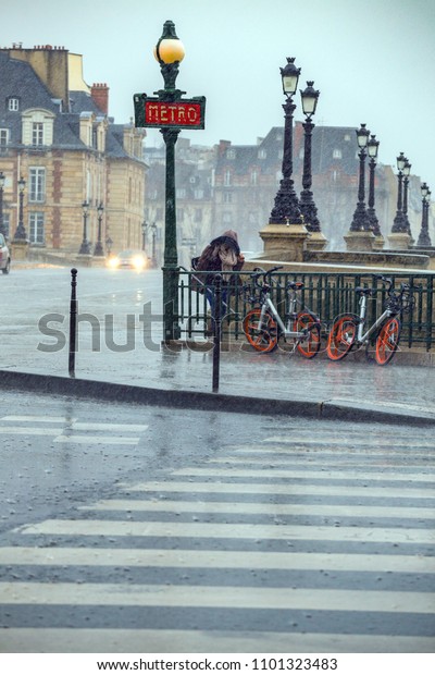 bad\
weather. heavy rain on the streets of\
Paris\
