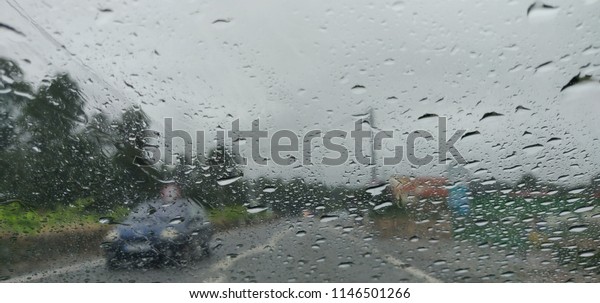 Bad\
weather and transit view through the\
windshield.