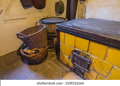 Bad Windsheim, Germany - 16 October 2019: Interior Views Of A German Village House. View Of An Old, Antique Kitchen Stove And Baskets