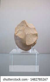 Badajoz, Spain - July 17th, 2019: Lower Paleolithic Biface Or Hand Axe. Archaeological Museum Of Badajoz