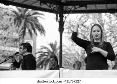 Badajoz, Spain - March 29, 2012: Sign Language Woman Interpreter Gestures During A Meeting That Protests Against Austerity Cuts