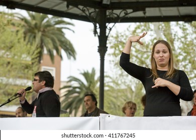 Badajoz, Spain - March 29, 2012: Sign Language Woman Interpreter Gestures During A Meeting That Protests Against Austerity Cuts