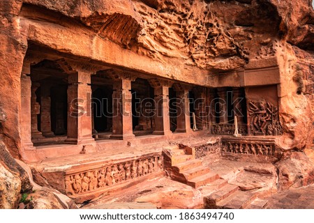badami cave no one chalukya dynasty ancient stone art from flat angle image is taken at badami karnataka india. it is unesco heritage site and place of amazing chalukya dynasty sotne art.