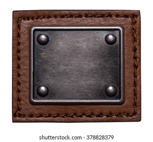 Badge Or Tag Made Of Brown Leather And Dark Metal Isolated On White