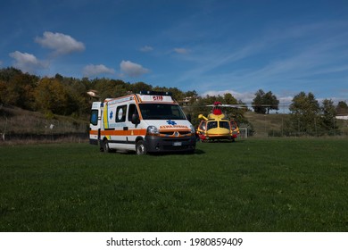 Badia Tedalda, Italy - May 10 2021: the regional rescue helicopter met the volunteers ambulance for the transfer of a patient in the vicinity of a car accident.