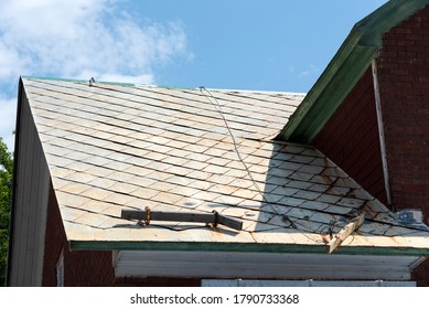 Badly Damage Metal Roof With Ice Breaker