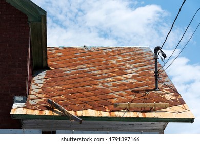 Badly Damage Metal Roof With Ice Breaker