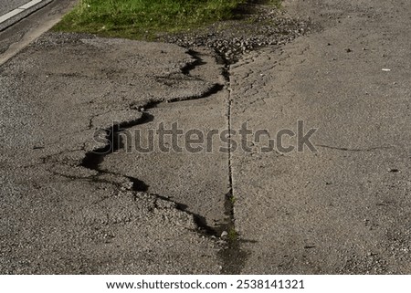 Similar – Cracks in asphalt Pothole