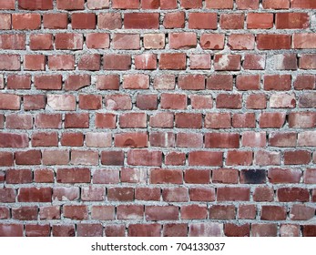 Badly Made Red Brick Wall With Mortar. Background.Shoddy Work.