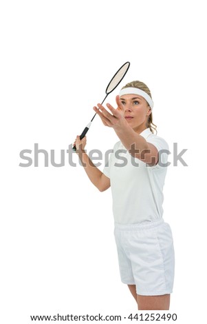 Badminton player playing badminton on white background