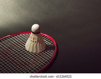 Badminton And Racket On Black Background.