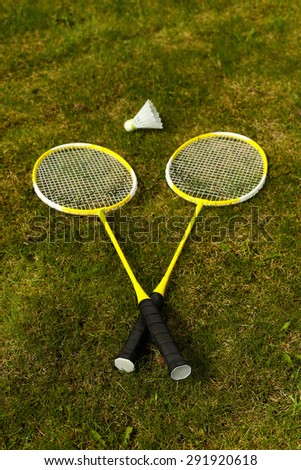Badminton rackets on the green grass