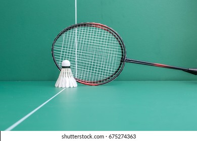 badminton rackets and shuttlecock  on the green table