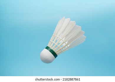 Badminton Shuttlecock Flying On Blue Background