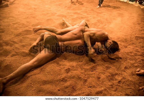BADNERA, MAHARASHTRA, INDIA 13 JANUARY\
2017 : Unidentified Indian wrestlers in action at Traditional\
wrestling competition on occasion of indian\
festival.