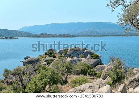 Bafa, Turkey - July 15, 2023: Bafa Lake and Necropolis of Latmos Herakleia Ancient city  