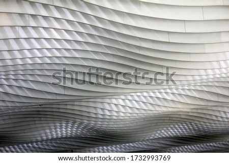 Baffle ceiling structure contrasting light and shadows. Noise and sound reduction architecture and design installed in airport