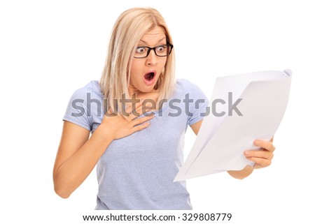 Baffled young woman looking at a piece of paper in disbelief isolated on white background