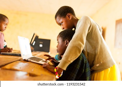 Bafoussam, Cameroon - 06 August 2018: Beautiful Image Of African School Children Learning To Use Computer In Classroom Of African School