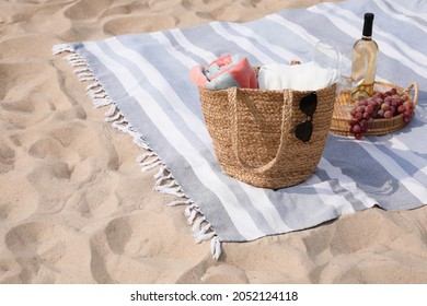 Bag, Blanket, Wine And Other Stuff For Beach Picnic On Sand