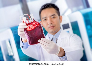  Bag Of  Blood  In Hand Asian Doctor