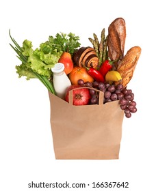 Bag Full Of Healthy Food / Studio Photography Of Brown Grocery Bag With Fruits, Vegetables, Bread, Bottled Beverages - Isolated Over White Background 