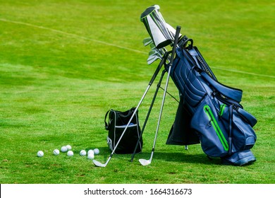 Bag Of Golf Clubs On The Golf Course.